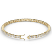 5 Carat Yellow Gold Round Shape Diamond Tennis Bracelet With Prong Setting.